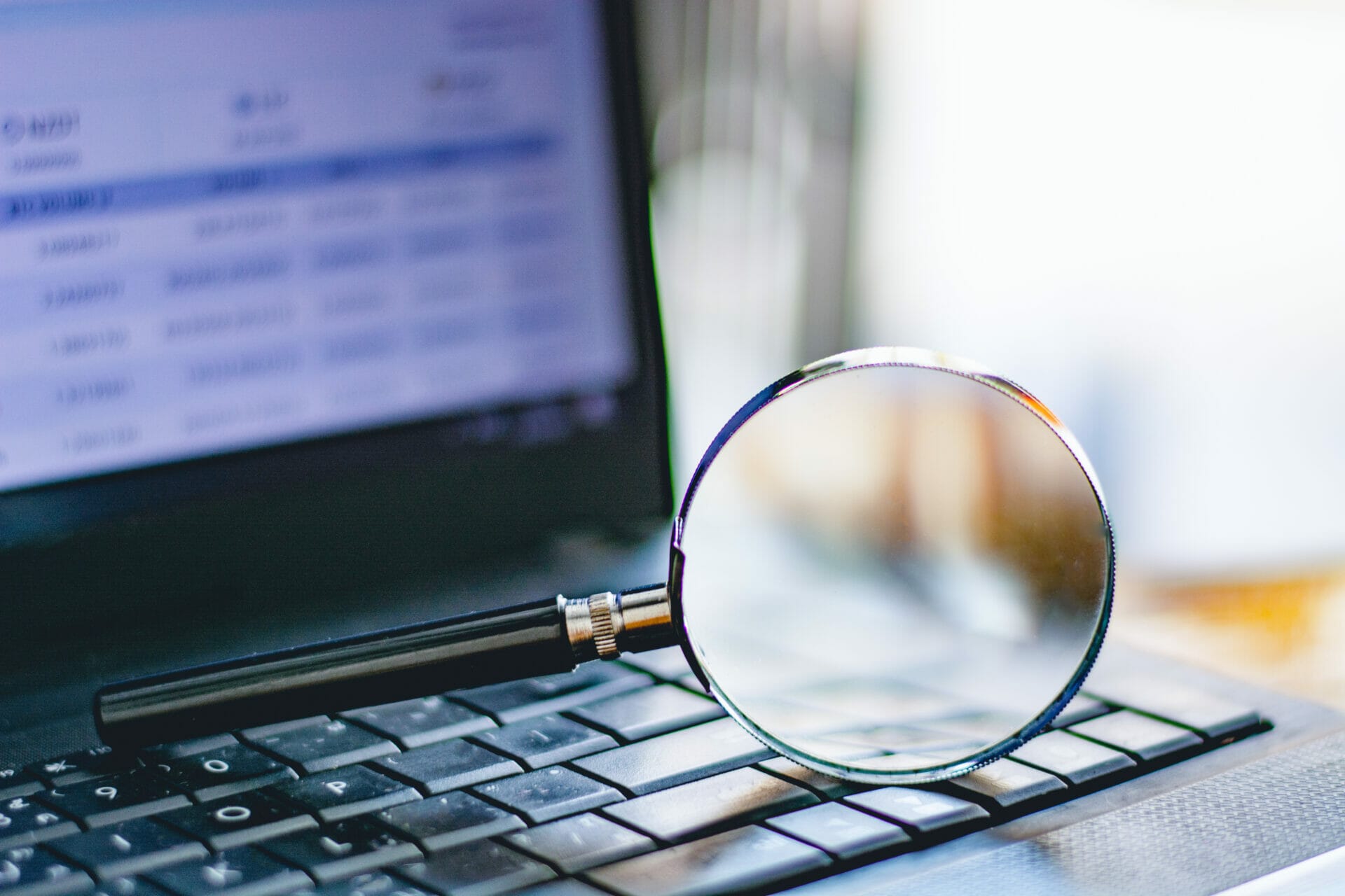 Magnifying glass on computer keyboard