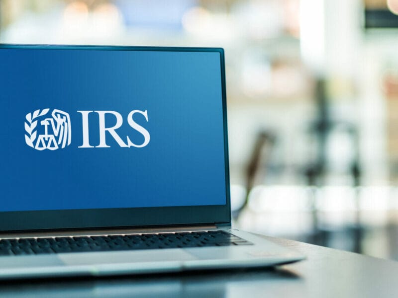 Photo of laptop with the IRS logo on screen