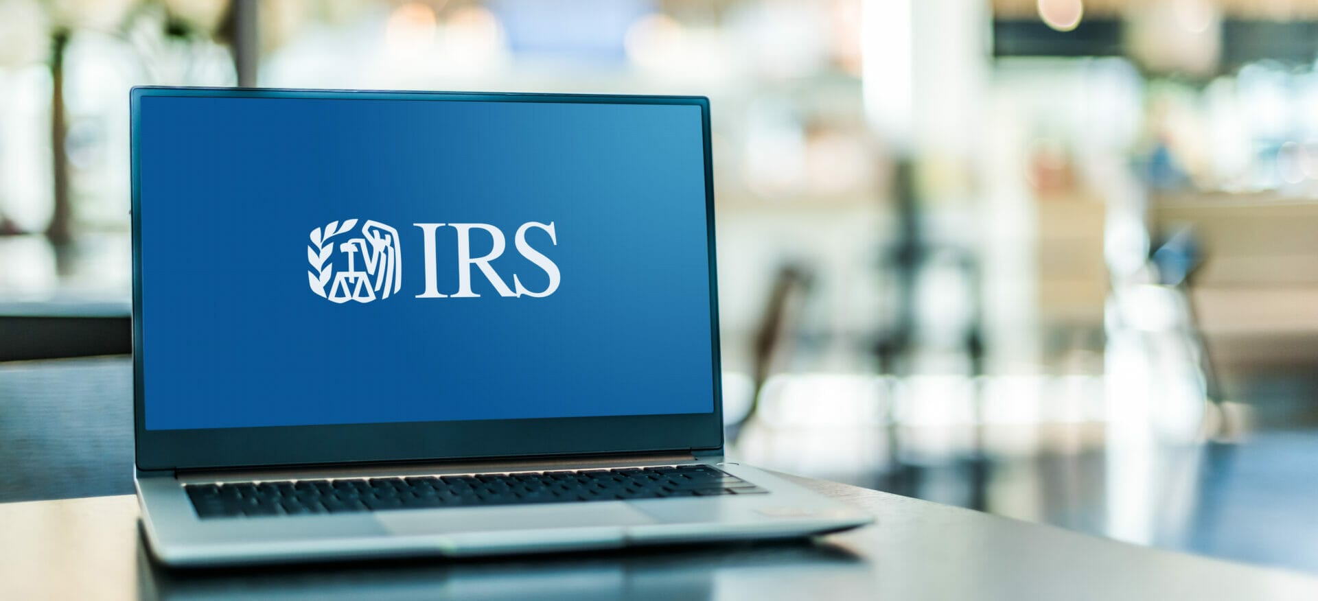 Photo of laptop with the IRS logo on screen