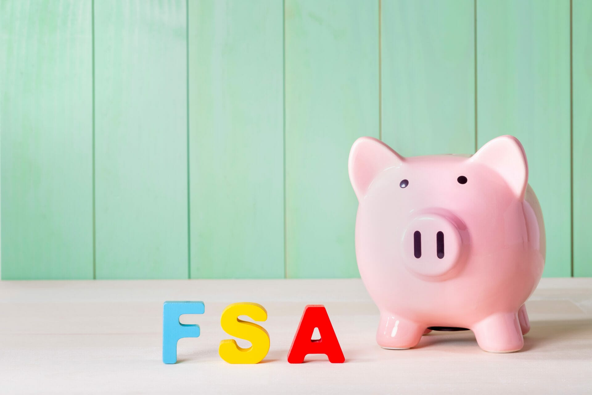 Piggy bank with FSA letters next to it