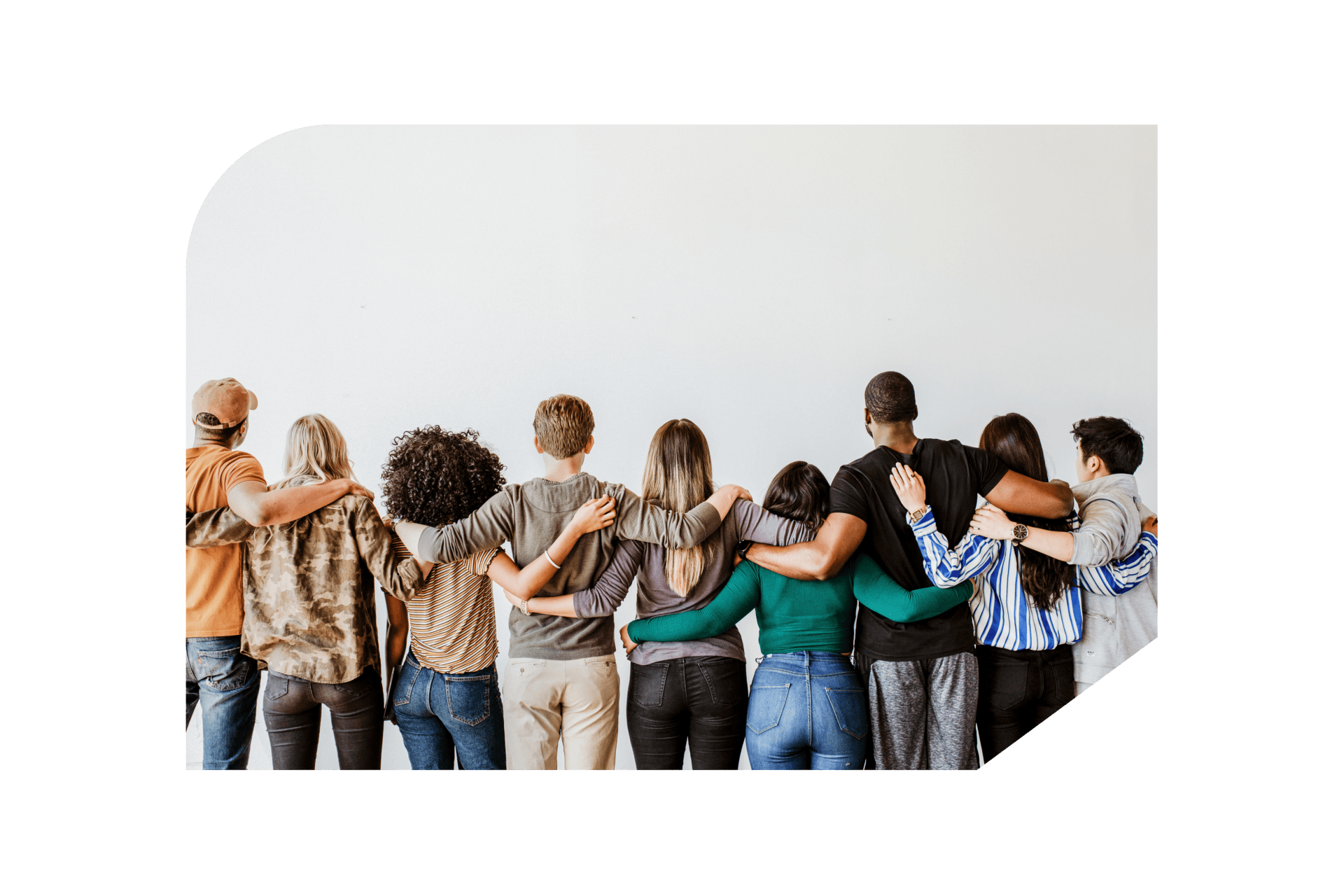 Group of diverse employees hugging facing wall