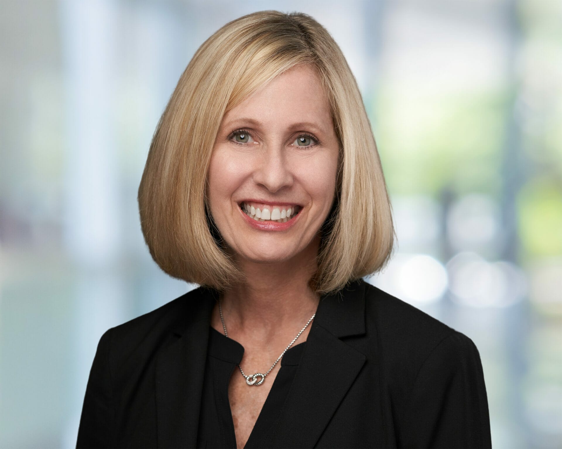 Photo of Blonde Haired Woman Smiling for Professional Headshot