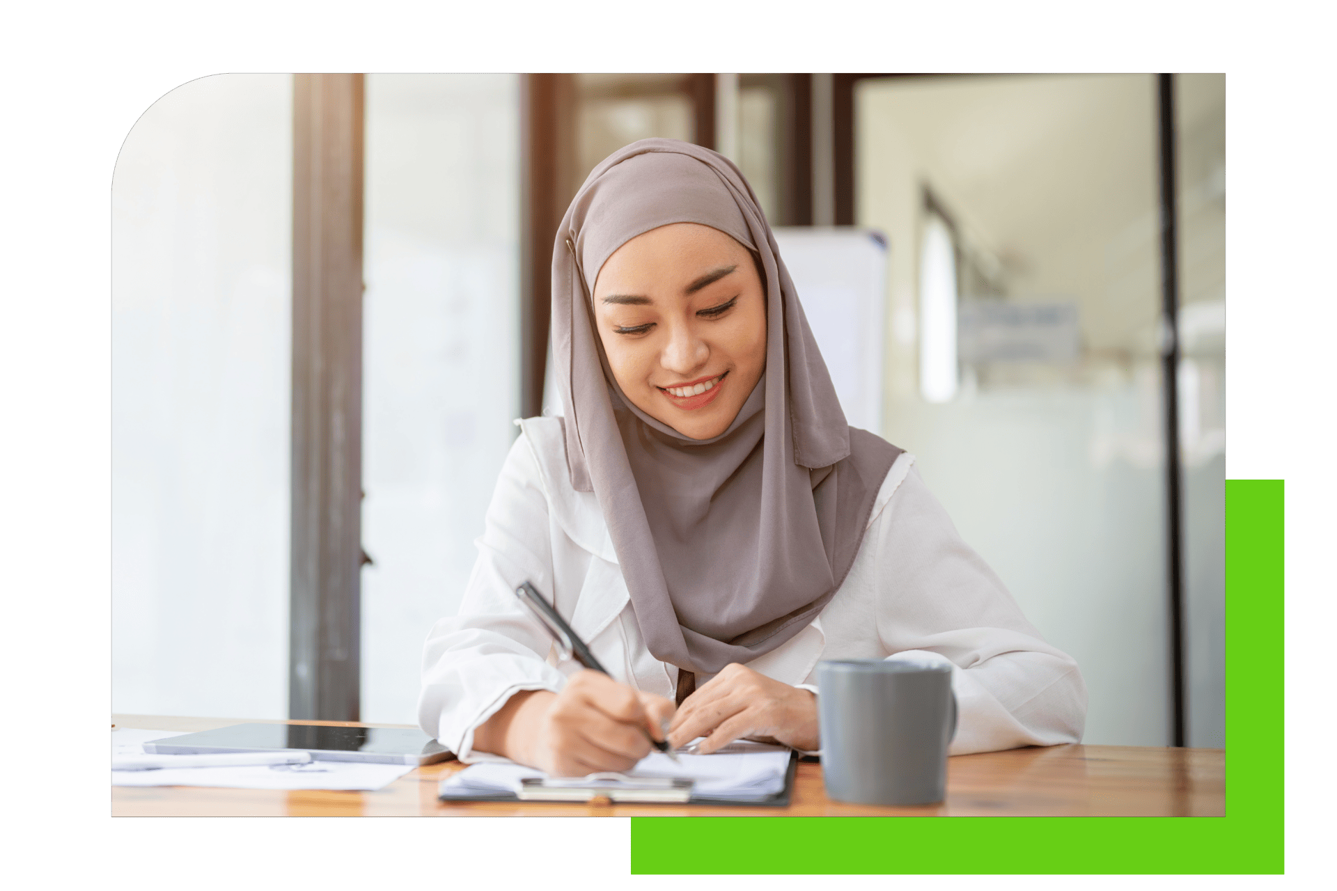 woman sitting in bright atmosphere filling out a form smiling