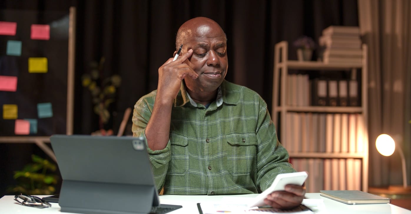 man checking loss of worker costs due to time tracking issues