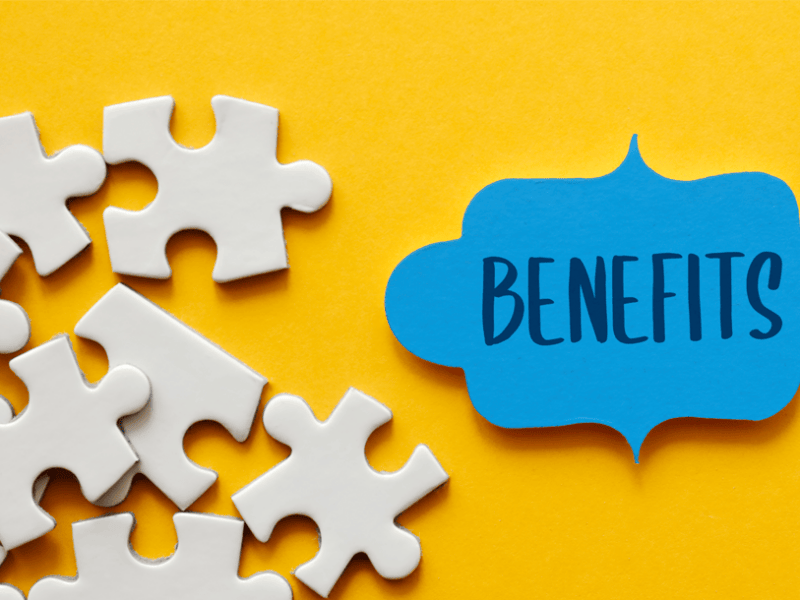 Puzzle pieces and the word benefits in blue