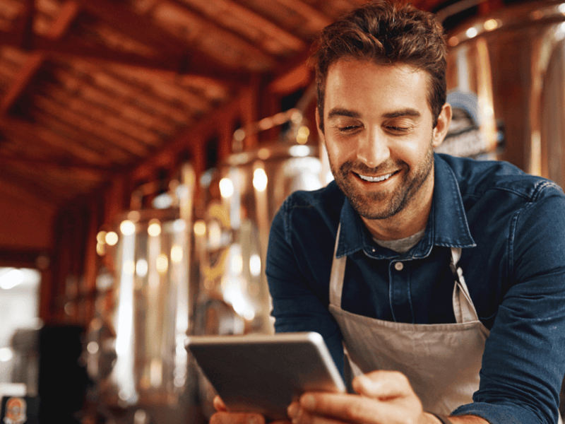 Food services worker staring at tablet