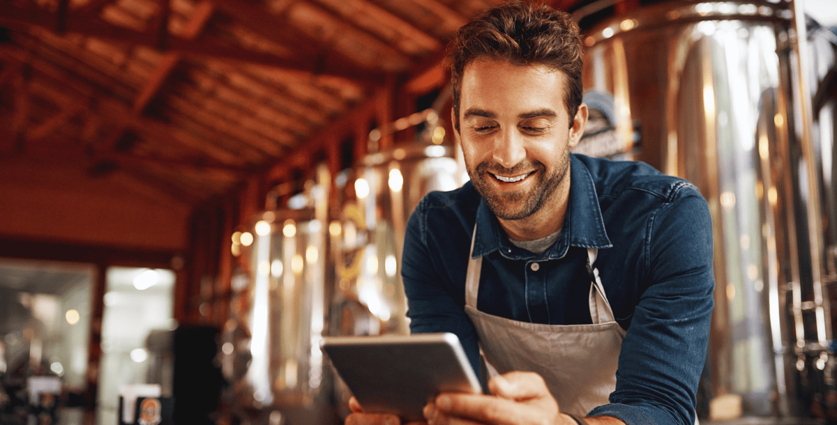 Food services worker staring at tablet