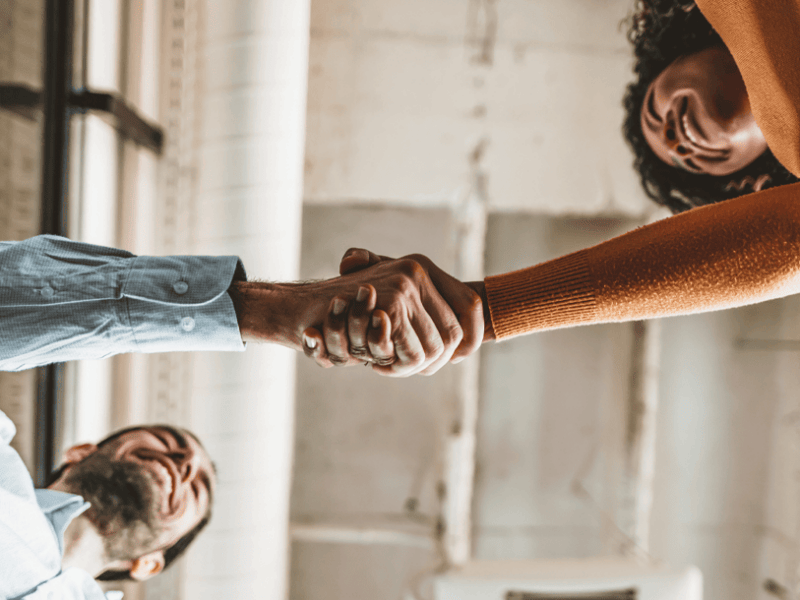 man and woman shaking hands