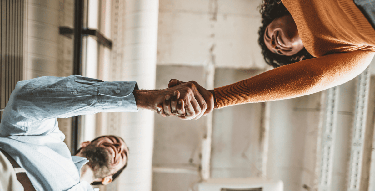 man and woman shaking hands