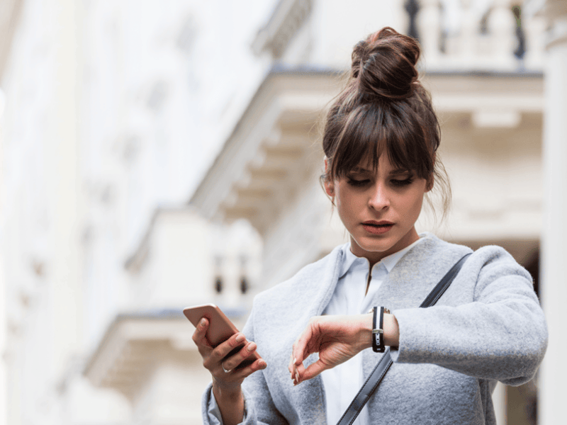 business woman watching the time on her watch