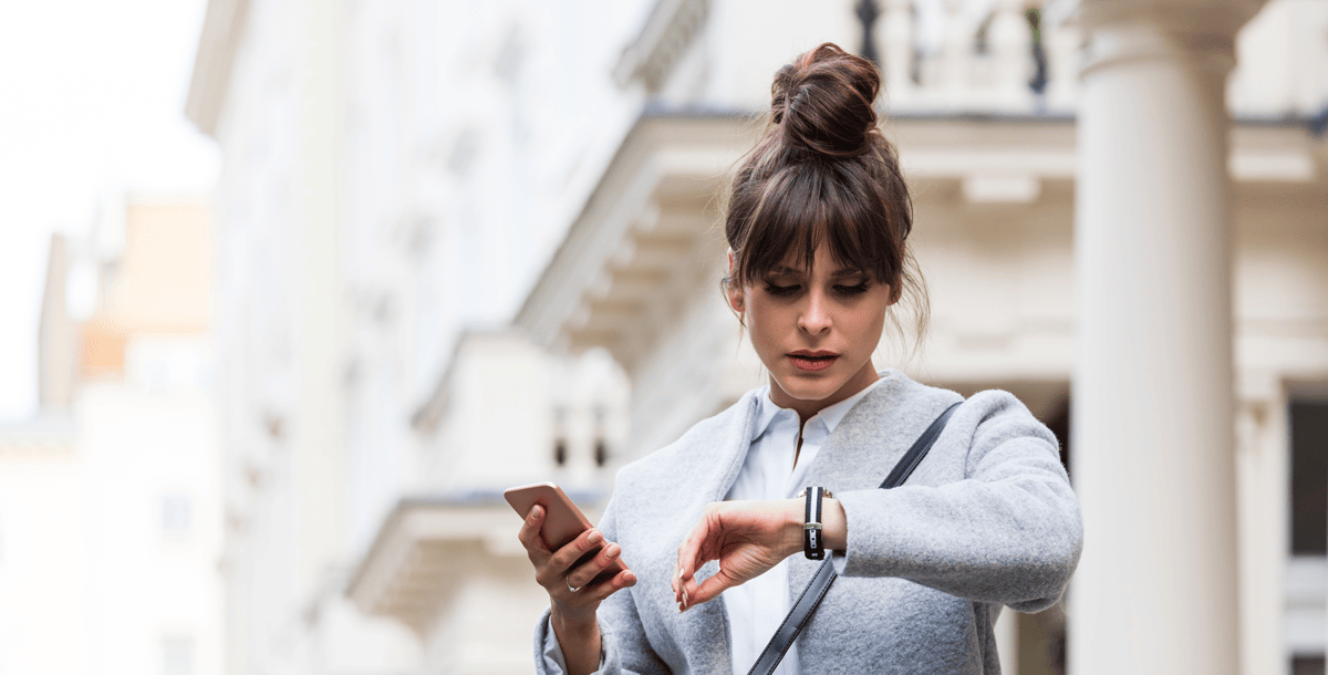 business woman watching the time on her watch