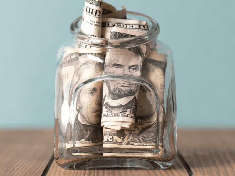 American money in clear glass jar