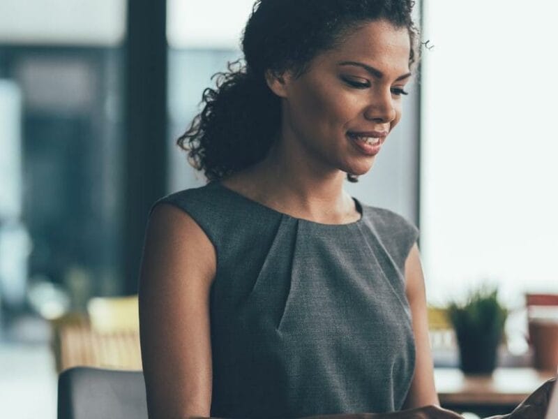 professional woman looking at laptop