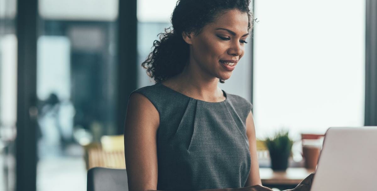 professional woman looking at laptop