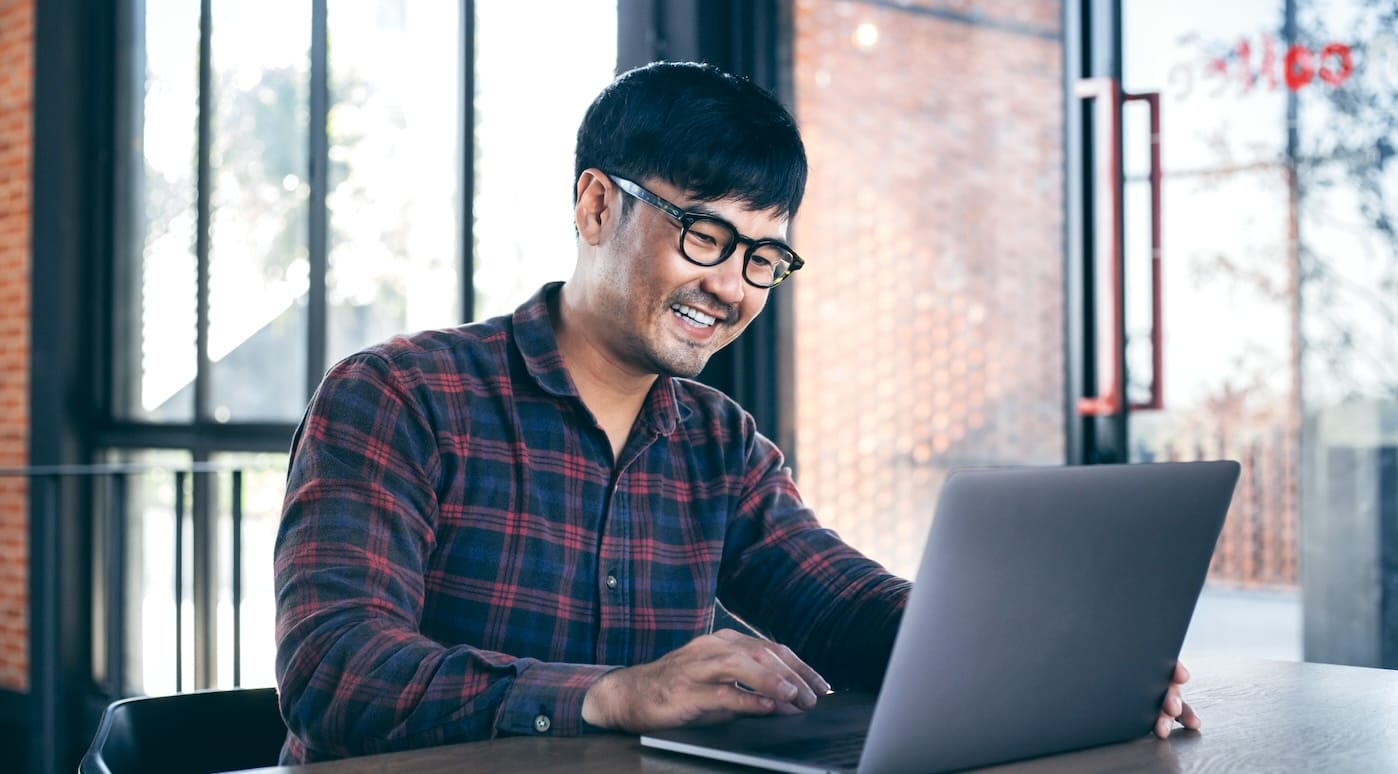 man on computer preboarding employees